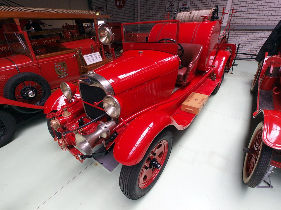 Fire Engine / Fire-Service Body — Period Ford-based fire vehicle at the Den Hartogh Ford Museum; fire equipment and chassis specifications vary