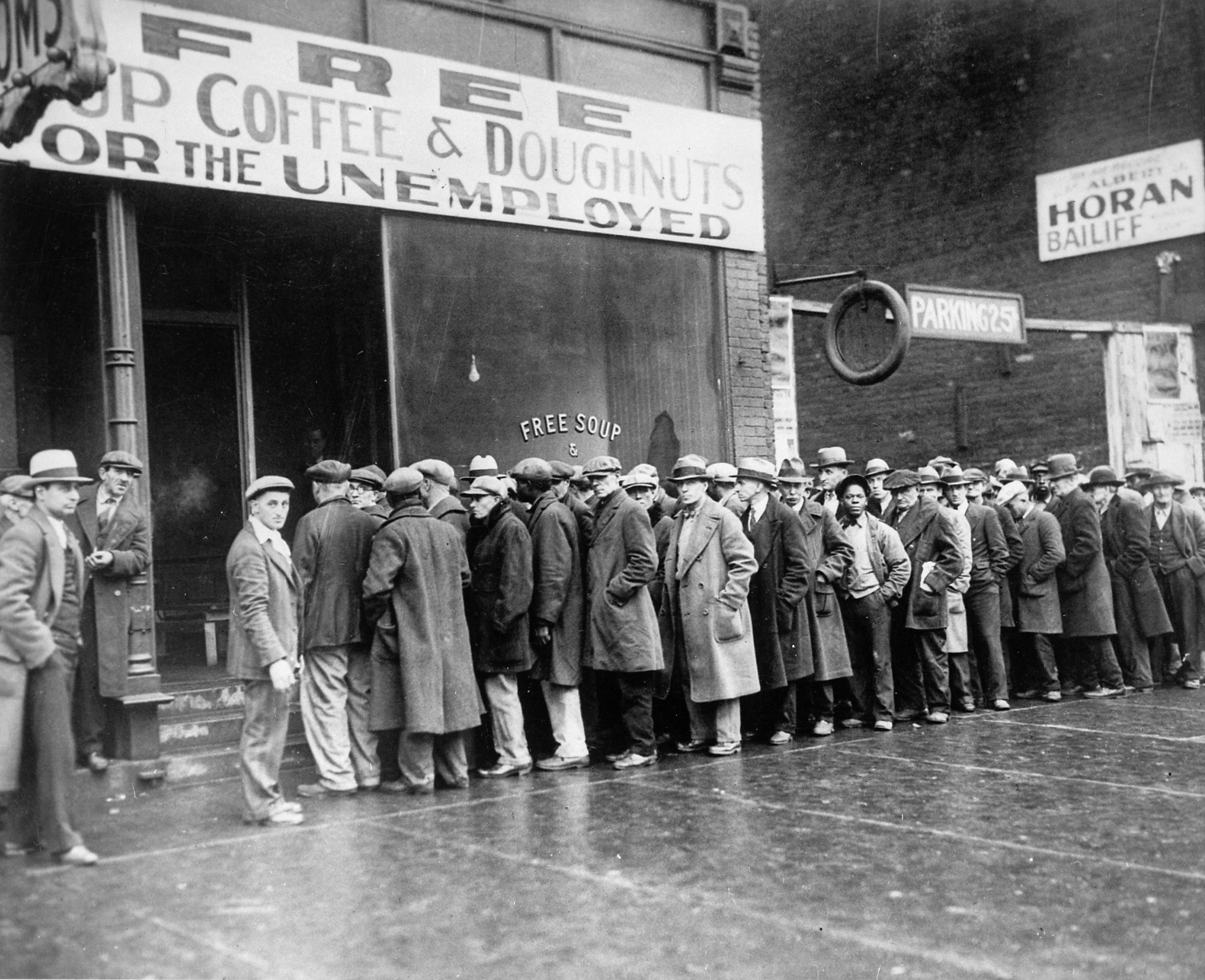Unemployed men lined up outside Al Capone’s Chicago soup kitchen in February 1931