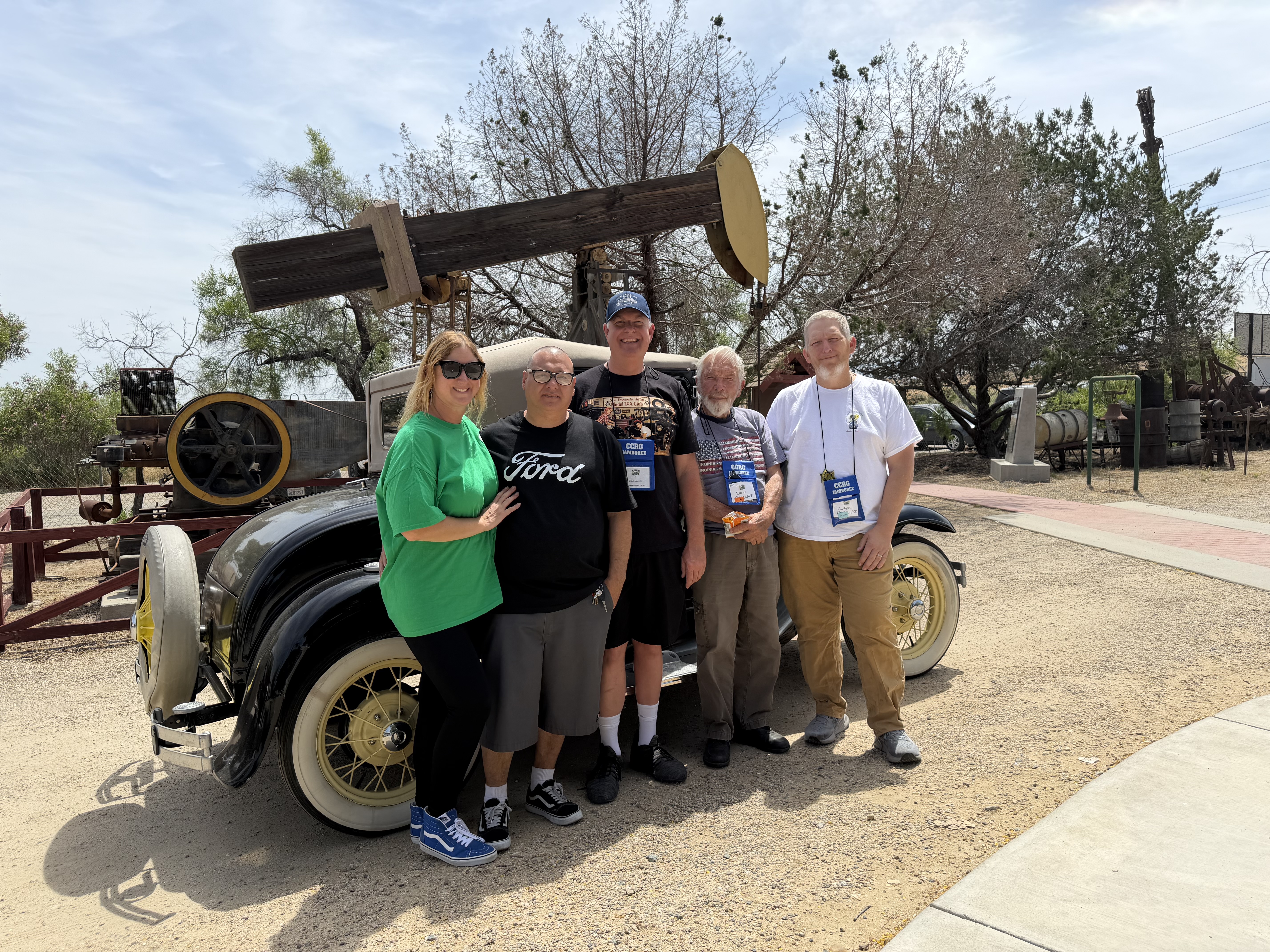 Club members gathered beside a Model A Ford