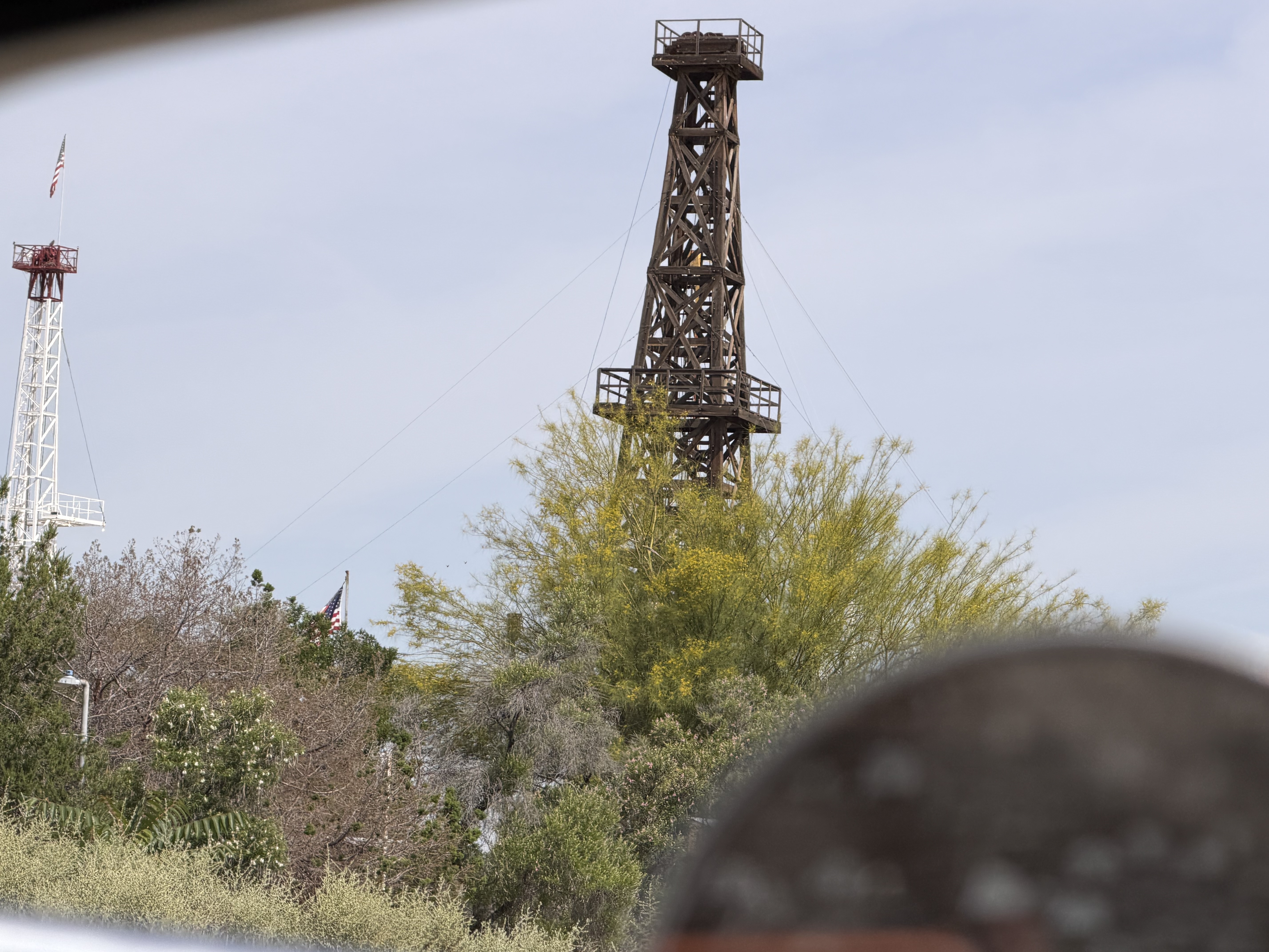 An oil derrick beside the tour route